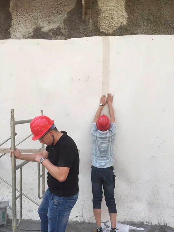 Application of sand cover strip